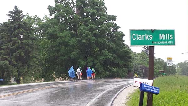 pilgrims walking in the rain