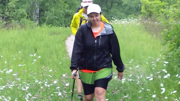 youth pilgrims hiking through fields