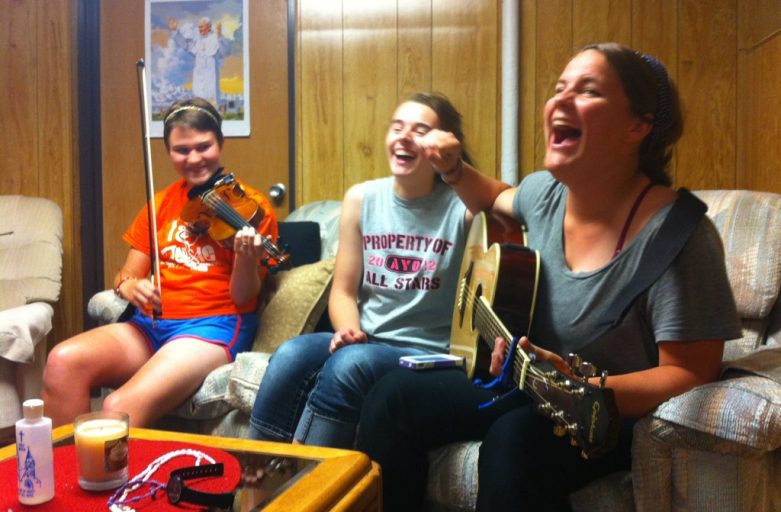 youth pilgrims making music